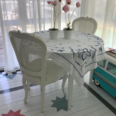 $99 white wooden round table 29"H 42"diameter-2 white caned chairs 38"H 18"L 16"depth