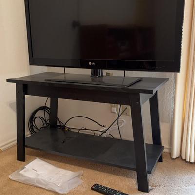 LG Plasma TV And TV Stand. TV Powers On.