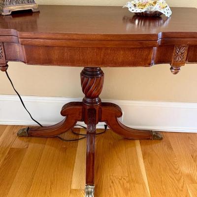 Vintage scalloped edge accent table with brass claw feet 