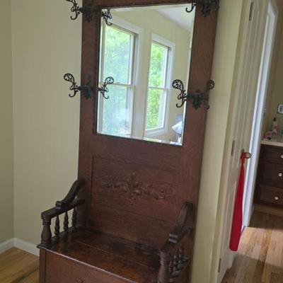 Antique hall tree with storage base 