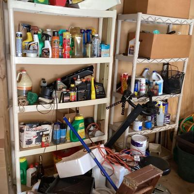 Large white shelves with cleaning supplies