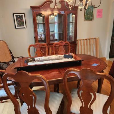 Dining room table, with leaf, 6 chairs and china hutch.