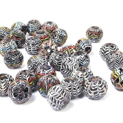 Sale Photo Thumbnail #286: Lot 287 collection of thirty islamic core formed glass beads