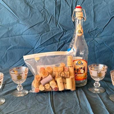 Wine Corks, Glass Bottle, And 4 Glasses