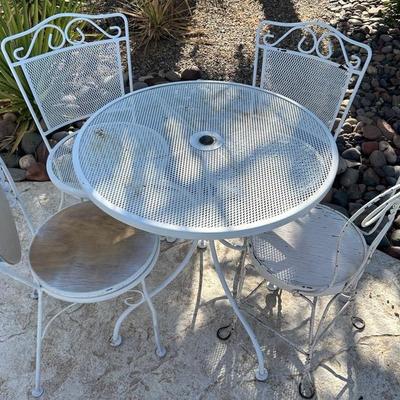 White Metal Patio Table And Four Chairs