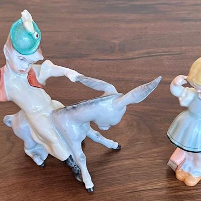 (2) Small Herend Hungary Hand Painted Porcelain Boy Riding Donkey And Girl With Books
