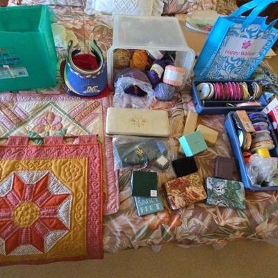 LLS086 Various Color Yarns And Ribbons In Spools Or Rolls, 2 Plastic Cases, 2 Hanging Quilts, Etc., 