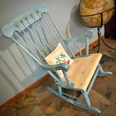 Rocker painted with palm trees