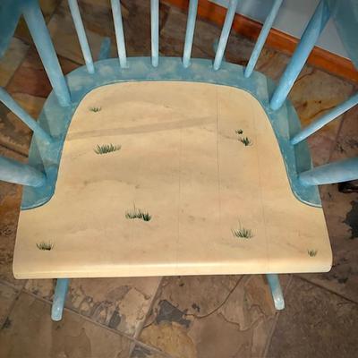 Rocker painted with palm trees