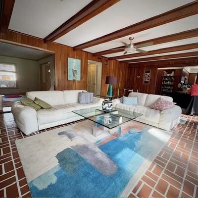 Scan Design Fat Boy white leather sofa and loveseat with West Elm area rug