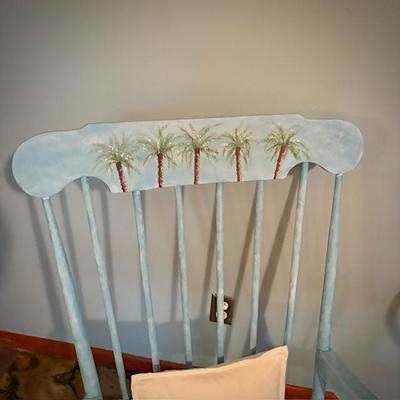 Rocker painted with palm trees