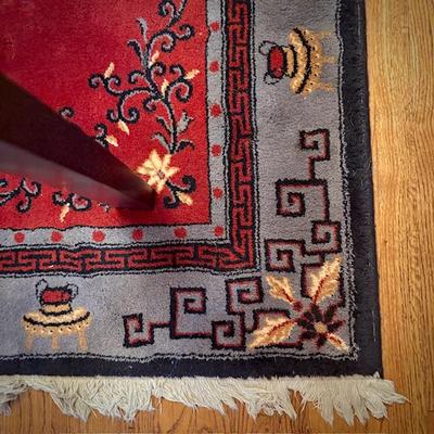 Red Chinese area rug (matching runner in bedroom)