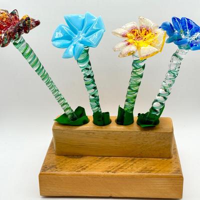 (4) Glass Flowers & Wooden Base
