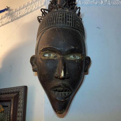 African Wooden Mask With Figures and Carved Details