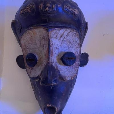 Carved Wooden Tribal Mask with Distinctive Features