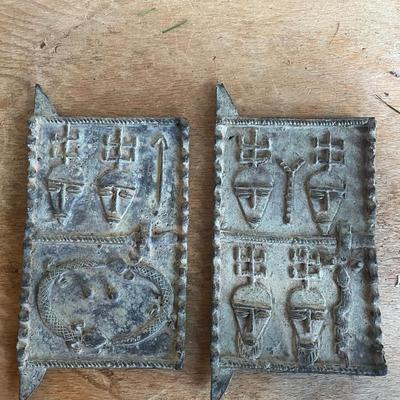 Cast Metal Plaques with Stylized Faces
