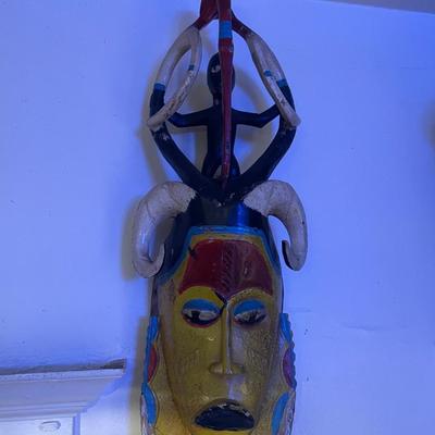 Carved Wooden African Mask with Horn and Figure Details