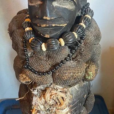 Carved Wooden Figure with Beads and Cloth Adornments