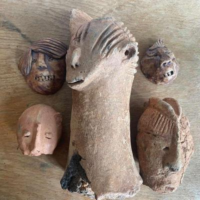 Clay Sculptures Featuring Animal and Human Faces