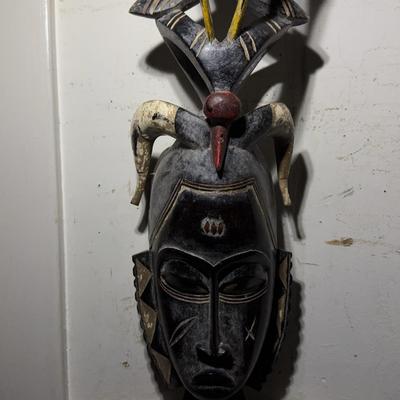 Hand-carved African Tribal Mask with Horns and Bird Motif