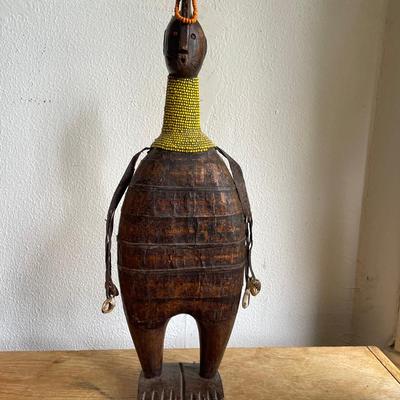 Carved Wooden Figurine With Beaded Neck and Shell Accents