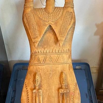 Carved Wooden Statue With Abstract Figures and Raised Hands