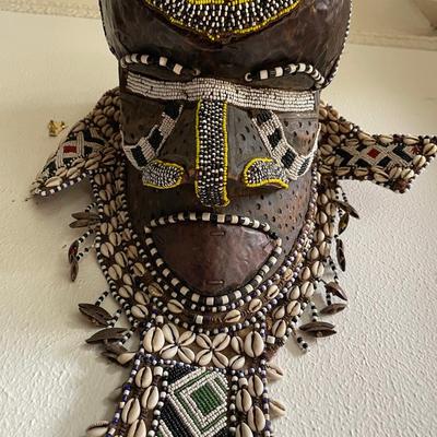 African Tribal Mask with Beads, Cowrie Shells, and Feathers