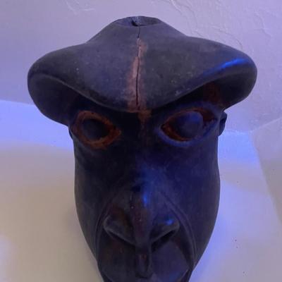 Hand-Carved Wooden Mask with Animalistic Features