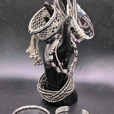 (8) Silver Tone Bracelets & Bangles featuring Monet