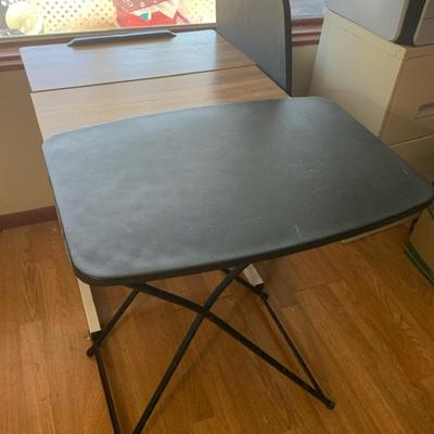 Black Folding Tables And A Rolling Table