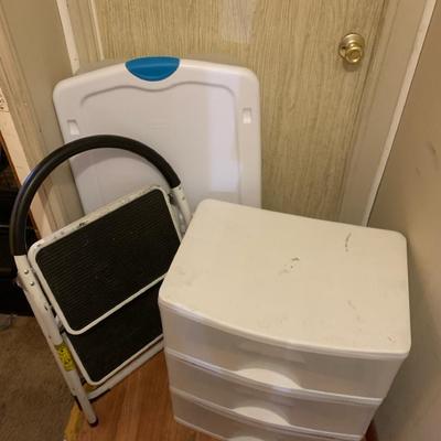 Plastic Storage Containers And A Step Stool
