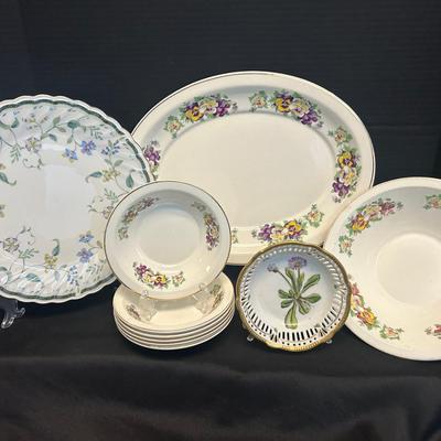 Mismatched Floral Plates And Bowls