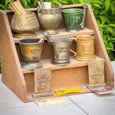Vintage Rack Full of Bronze & Ceramic Pharmacy Award Mortars