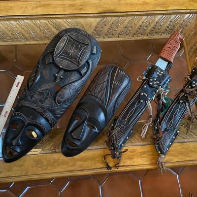 Lot Of Machetes And Carved African Masks