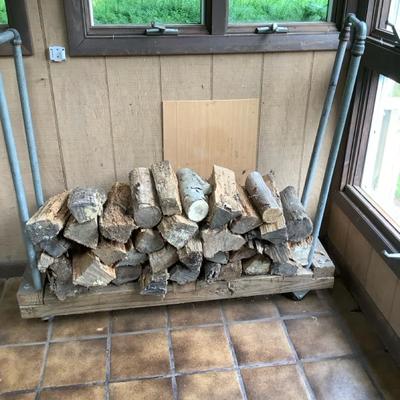 Wooden Trolley On Wheels With Chopped Wood For Fireplace