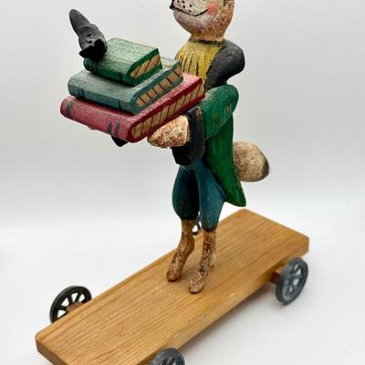 Carved Folk Art Fox on Wheels with Books and Bird