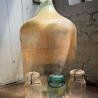 Vintage Ball Jars In Clear And Aqua Along With A Carboy 
