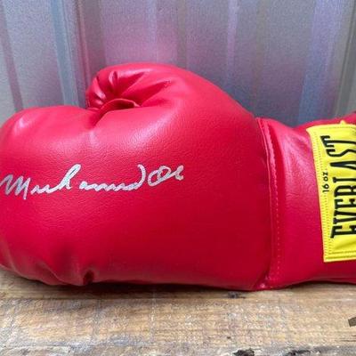 Sale Photo Thumbnail #161: #1864 • Muhammad Ali Everlast Left Hand Signed Boxing Glove
