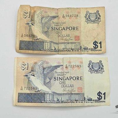Sale Photo Thumbnail #122: #1706 • (2) One Dollar Singapore Bills
