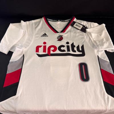 Lot 208: Signed Portland Trail Blazers “Rip City” jersey for Damian Lillard