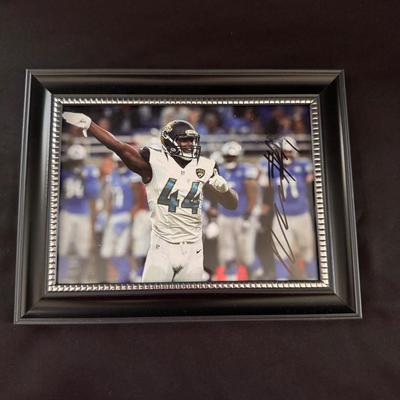 Lot 241: Autographed Photo of Myles Jack, former linebacker for the Jacksonville Jaguars.