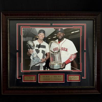 Lot 459: Framed Dual Autographed Photo – Tom Brady & David Ortiz with Championship Trophies