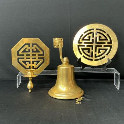 Brass Trivet, Sconce, And Bell