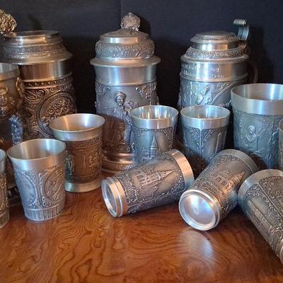 German Beer Steins and Embossed Pewter Goblets