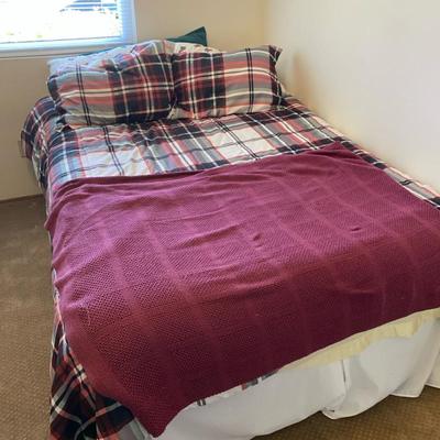 Cozy Full-Size Bed with Plaid Comforter and Pillows