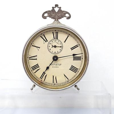 Lot #24 - Antique Early 1900s Waterbury "Must Get Up" Wind up Alarm Clock With Top Finial and Stabilizing Legs