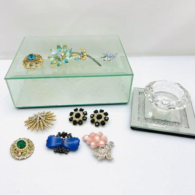 Lot #199 - Various vintage brooches and glass jewelry box plus candle holder 