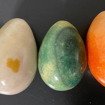 Four Polished Stone Eggs in Various Colors and Sizes