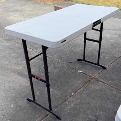 Adjustable Height Folding Table
