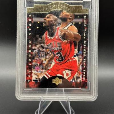 Sale Photo Thumbnail #20: Michael Jordan Graded Basketball Card Chicago Bulls Die-Cut Card with Jersey Swatch - Near Mint 8.5 +
